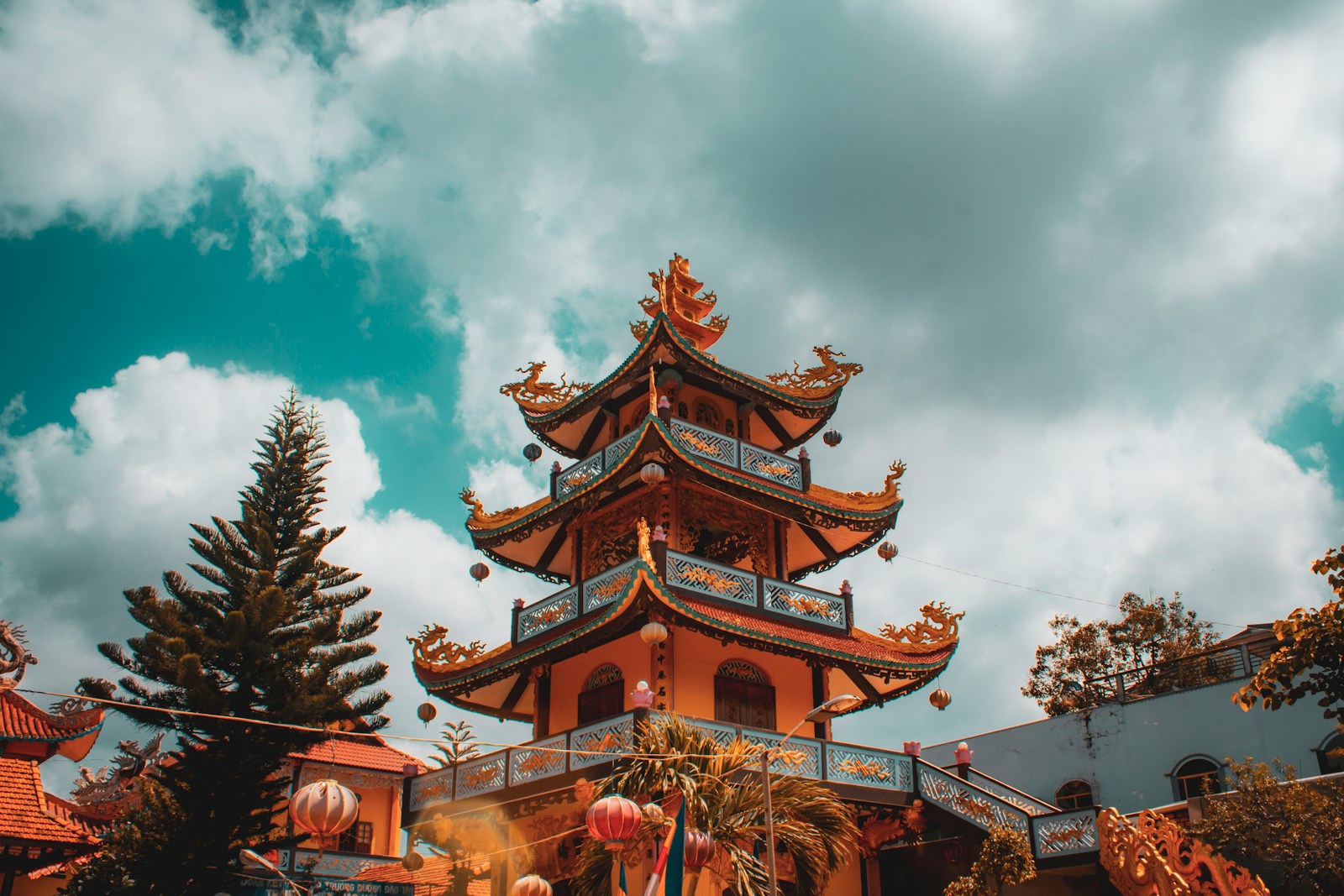 brown and green pagoda temple under blue sky