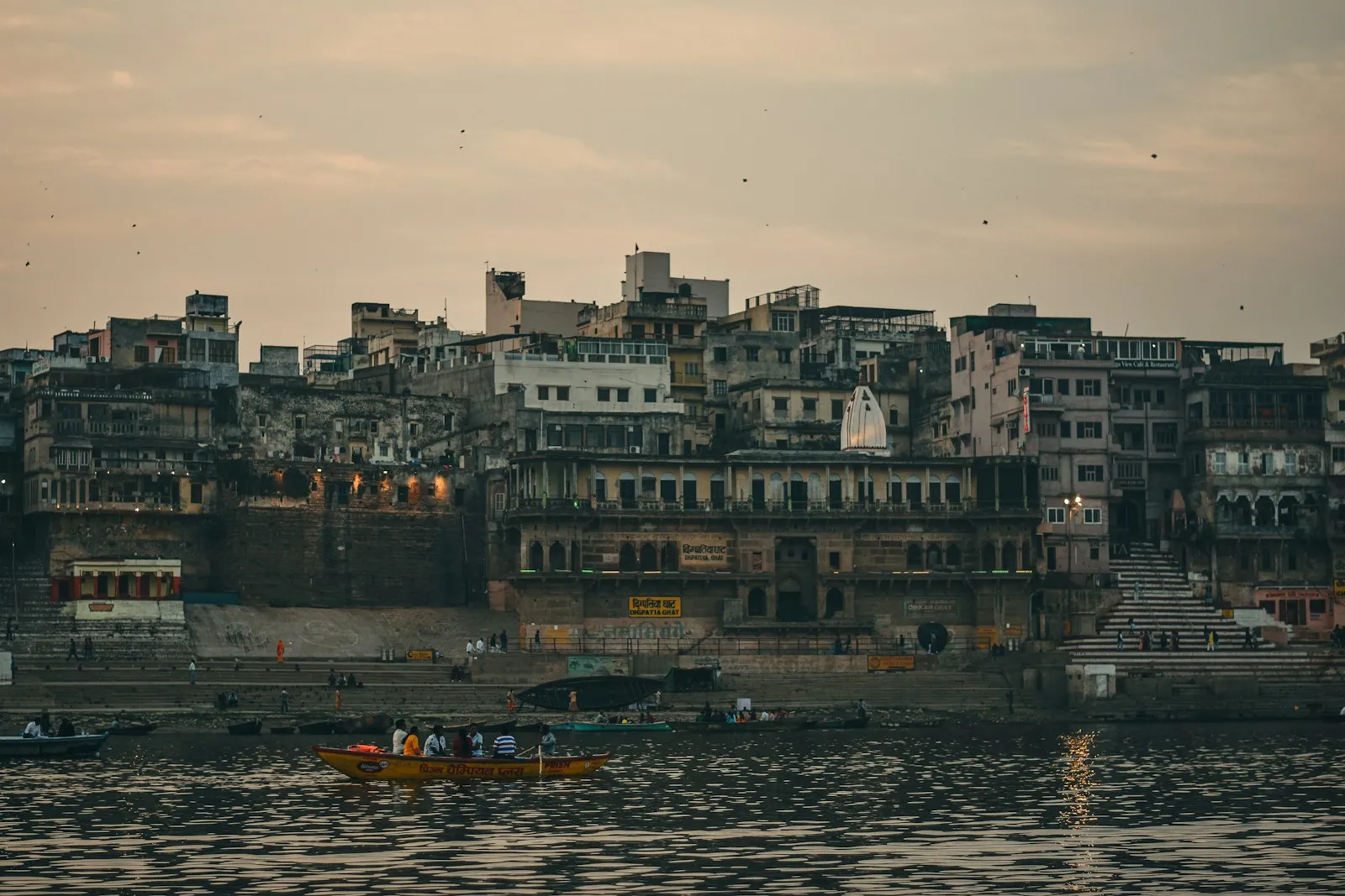 Photo by Aman Gupta a boat floating on top of a body of water